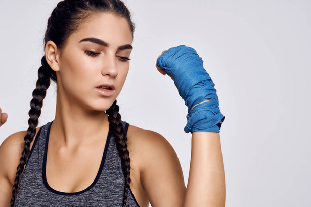 athletic brunette in boxing bandages exercise fitness martial art - Foto, afbeelding