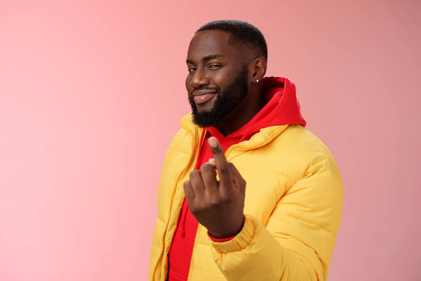 Cheeky flirty black bearded guy asking come closer beckon index finger camera smiling make smug face have plans for you alluring join, standing pink background devious grin - Photo, Image