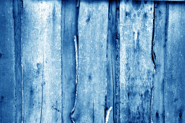 Wall made of uncutted weathered wood boards in navy blue tone. Abstract background and texture for design. - Foto, Imagen
