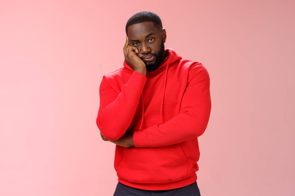 Bored annoyed african-american guy look sceptical dying boredom cannot wait go home lean head palm raise eyebrow judgemental ignorant, standing bothered irritated pink background - Photo, Image