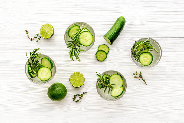 Lemonade with cucumber lime and herbs in glasses - Valokuva, kuva