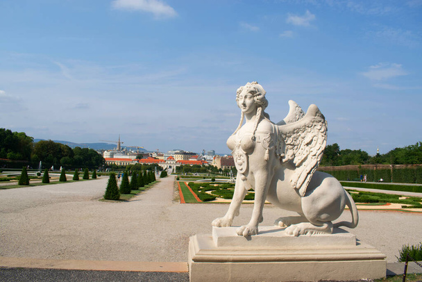 Greco-Roman styled sphinx statue sited in the formal gardens of the Schloss Belvedere palace in Vienna, Austria - Photo, Image