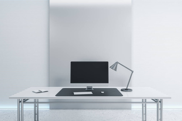 Desk with empty black computer screen in modern white office interior with daylight. Mock up, 3D Rendering. - Foto, afbeelding