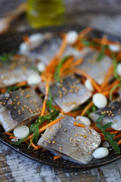 Pickled herring with spices. Healthy snack. Norwegian herring. - Photo, Image