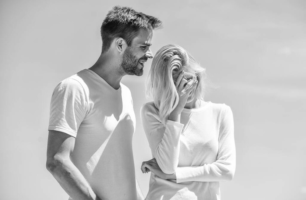 Love story. Man and woman white clothes sunny day outdoors. Communication problems. Summer romance. Family love. True love. Romantic relations. Couple in love blue sky background. Devotion and trust - 写真・画像