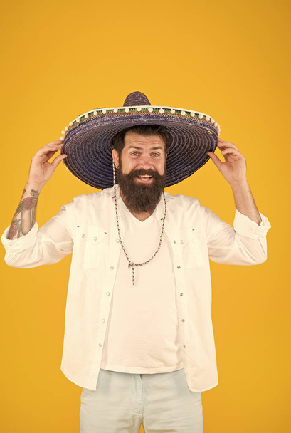 Ancestry language and cultural traditions. Discover ethnic and geographic origins. Bearded man in mexican hat. Mexican man wearing sombrero. Guy in wide brim hat. Ethnic concept. Ethnic background - Foto, Imagen