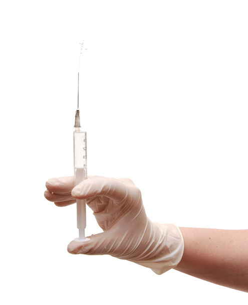 Hand holding syringe isolated on white background - Photo, Image