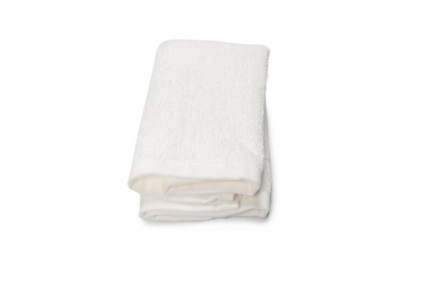 White fluffy cotton towel isolated on a white background. Spa and resort.  - Fotó, kép