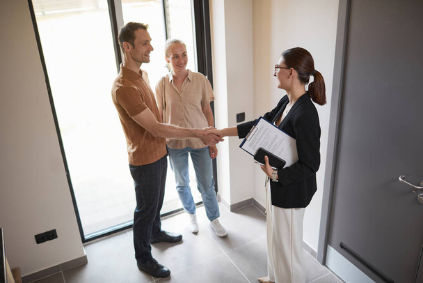 Couple Greeting Real Estate Agent - Photo, Image