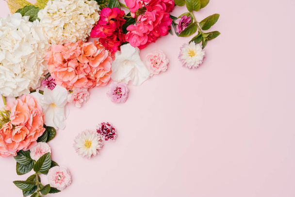 Composition of mixed flowers on pink background. top view, copy space. - Photo, Image