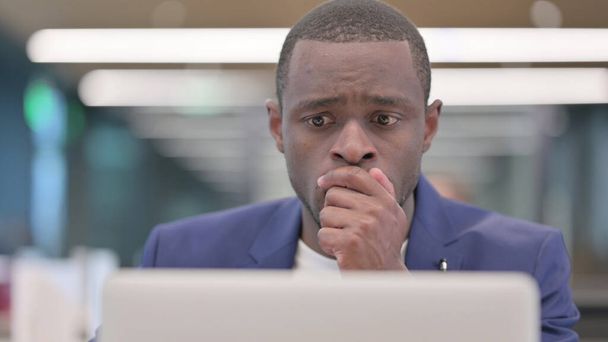 Young African Businessman with Laptop having Loss, Failure - 写真・画像