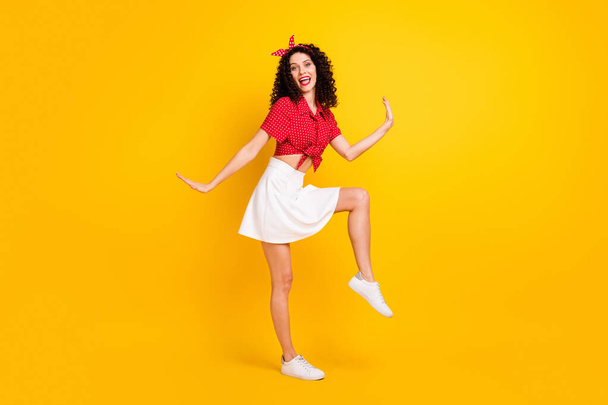 Full size photo of cute optimistic brunette hair lady dance wear red top skirt isolated on yellow color background - Foto, Imagem