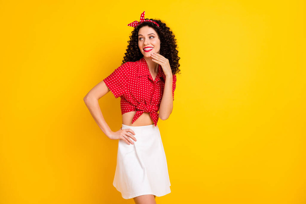 Photo of optimistic nice brunette lady stand look empty space wear shirt band isolated on yellow color background - Foto, imagen