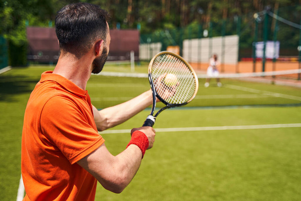 Sportsman playing a singles match with his tennis partner - Fotó, kép