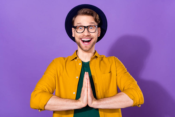 Photo of positive cheerful charming amazed man clap hands present gift isolated on purple color background - Valokuva, kuva