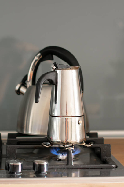 kitchen mixer with a kettle on background, close up - Fotó, kép