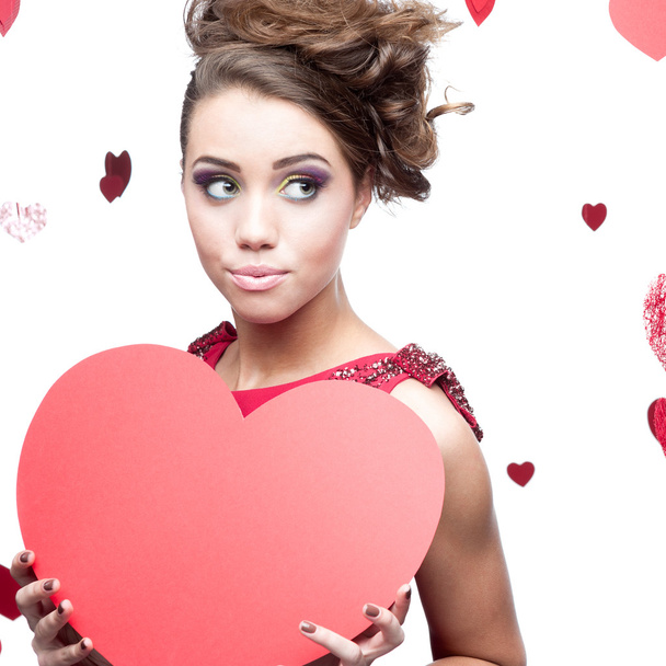 young cheerful woman holding red paper heart - Foto, Imagen
