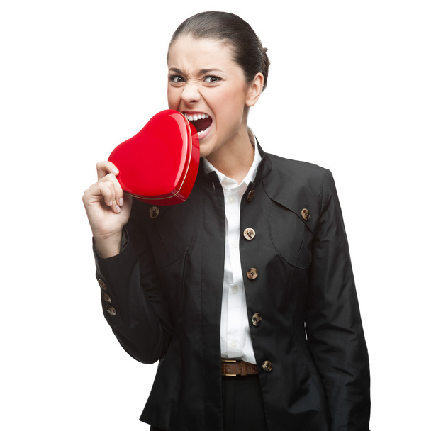 young cheerful businesswoman holding red heart - Foto, Imagen