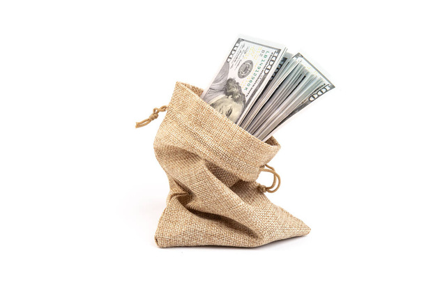 dollars in a burlap sack isolated on white background - Photo, Image