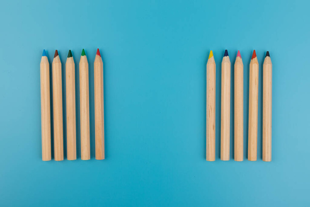 Colour pencils on blue background. Back to school. Education concept - Fotografie, Obrázek