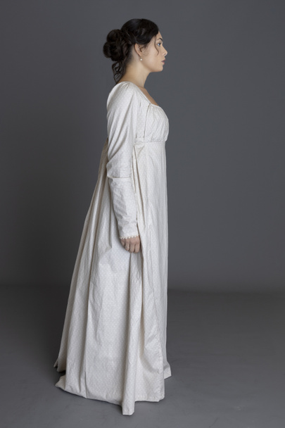 A Regency woman wearing a long-sleeved printed cotton gown - 写真・画像