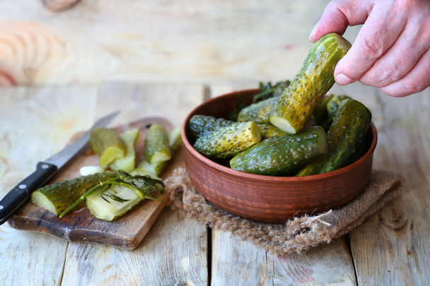 Lightly salted fermented cucumbers. Healthy food probiotics. Pickled cucumbers. - Photo, Image
