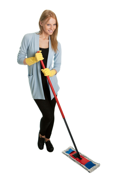 Cheerful woman having fun while cleaning - Zdjęcie, obraz