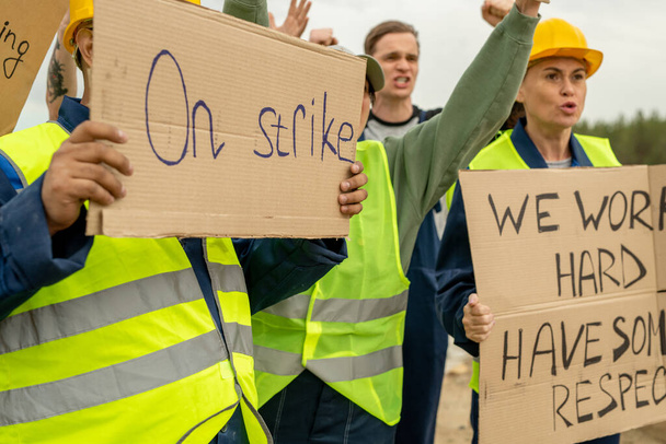 Group of angry builders or miners with placards - Foto, Imagem