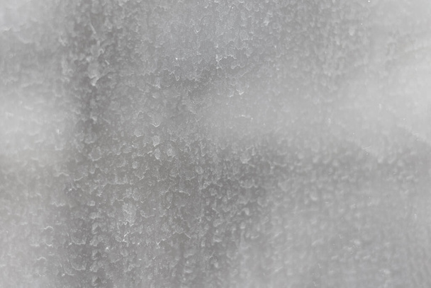 The surface of the dirty window glass, covered with dusty traces of raindrops. Blurred abstract texture. - Foto, Imagen