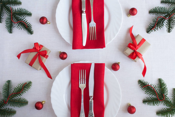 Christmas table setting on the white tablecloth. Top view. Close-up. - Foto, Bild