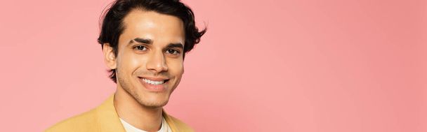 happy young man smiling isolated on pink, banner - Fotoğraf, Görsel