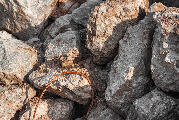 Large stones with reinforcement at a construction site close-up.  - Foto, Imagem
