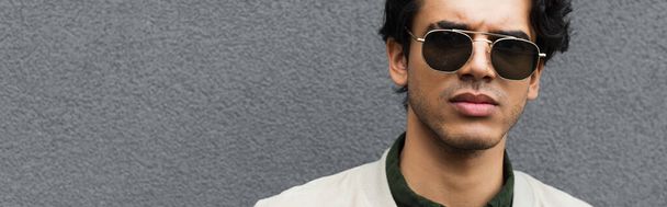 young man in stylish sunglasses posing outside, banner - Foto, Imagen