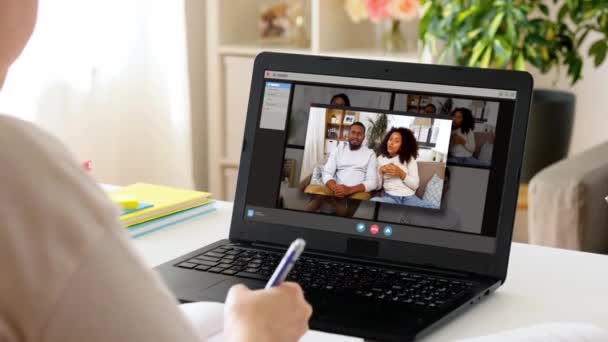 woman with laptop having video call at home - Filmati, video