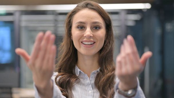 Portrait of Young Businesswoman Pointing at Camera, Inviting - Photo, Image
