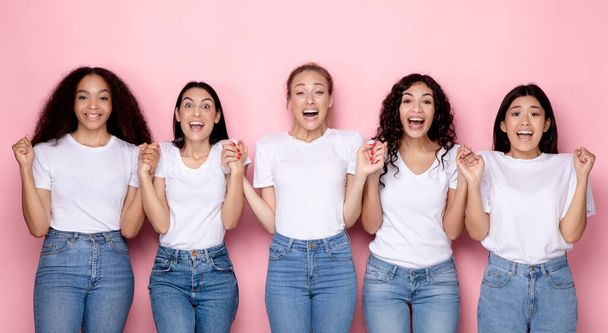 Excited Millennial Women Holding Hands Over Pink Background, Panorama - Zdjęcie, obraz