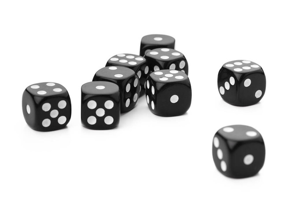 black dice on a white background - 写真・画像