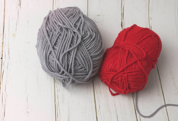 Grey and Red yarn  put on wooden timber board - Photo, Image