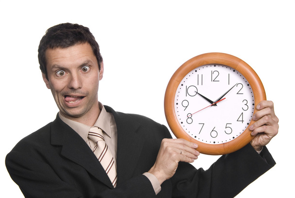 Silly business man portrait with a clock - Фото, изображение