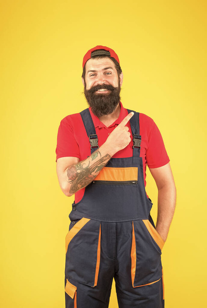 just look at that. electrician repair and fix. professional delivery loader service. confident in uniform. working on construction site. bearded male handyman. happy mature man worker with beard - Fotoğraf, Görsel
