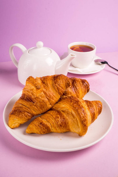 Top view of tasty breakfast with cereal flakes and croissants with coffee - Photo, Image