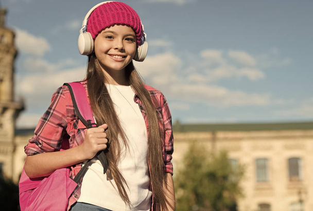 Feel the sound. Happy kid listen to music urban outdoors. Hi-Fi stereo sound. New technology. Modern life. Summer vacation. Travel and wanderlust. Sound that your ears deserve - Photo, Image