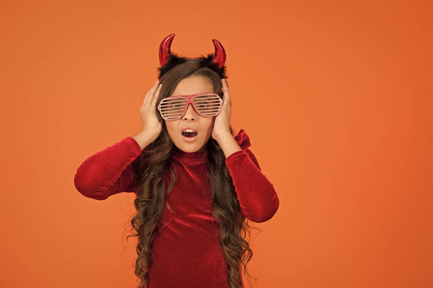 oh no. trick or treat. celebrate the holidays. childhood. happy halloween devil girl. teenage child in imp horns. cheerful kid wear funny party glasses. time to have fun. carnival costume party - Fotografie, Obrázek