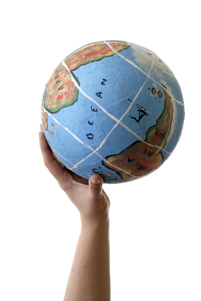 Globe in a human hand isolated on white - Zdjęcie, obraz