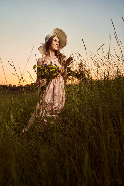 Picking up flowers in the meadow is so relaxing - Фото, изображение