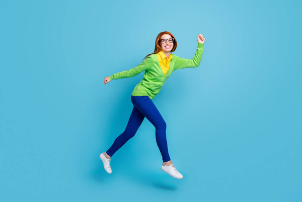 Full length body size view of nice funny cheerful girl jumping walking isolated over bright blue color background - Foto, Bild