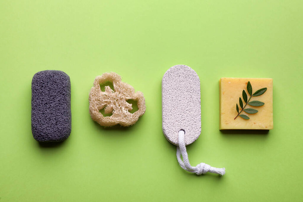 Flat lay composition with pumice stones on light green background - Foto, Imagem