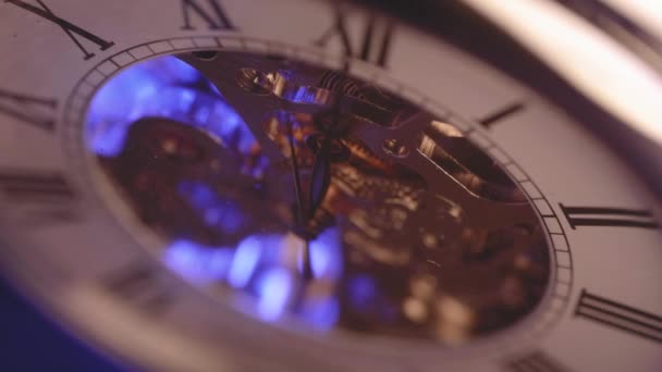 Macro shot of watch with light passing behind and illuminating cogs - Footage, Video