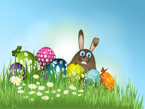 Conejo de Pascua en la hierba con huevos
 - Vector, Imagen
