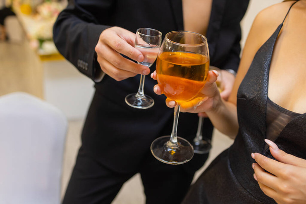 Clinking glasses with alcohol and toasting, party. - Valokuva, kuva